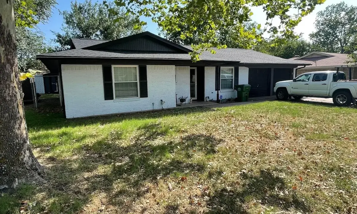 Professional roofing crew working on a residential roof in Plain City